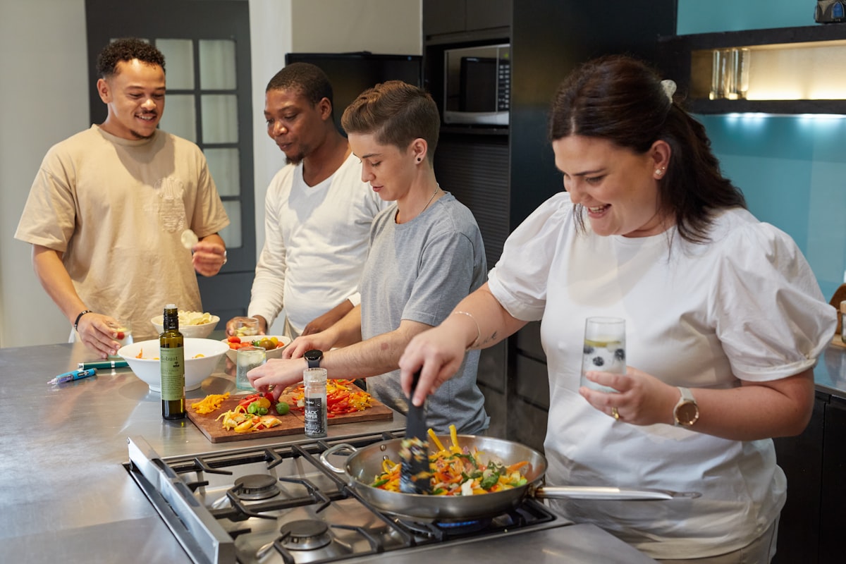 Expert instructor preparing fresh vegetables in a professional kitchen setting